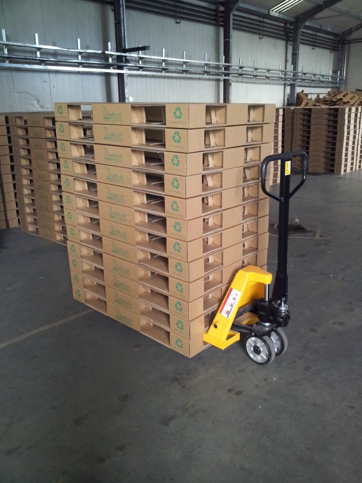 Corrugated pallet technology in an industrial production or logistics environment.
